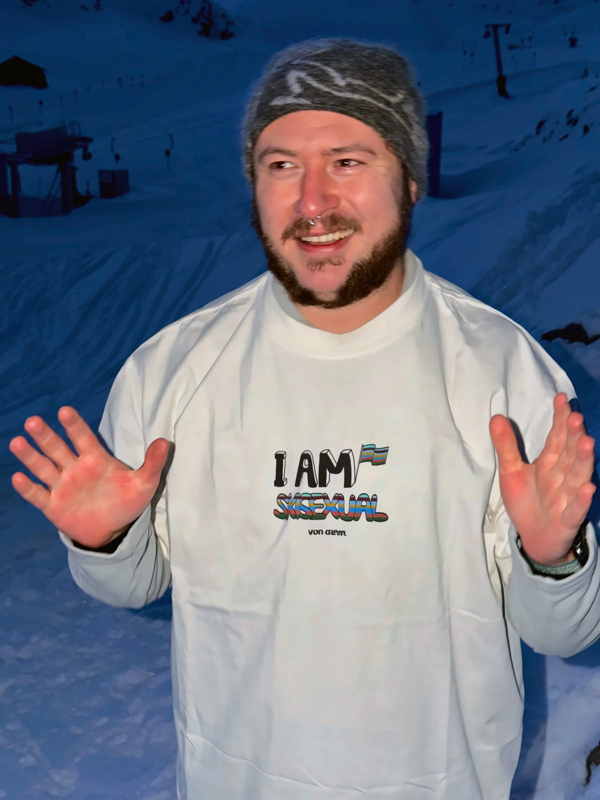 Von Alpen "I am Skisexual" tee in the snow at dusk