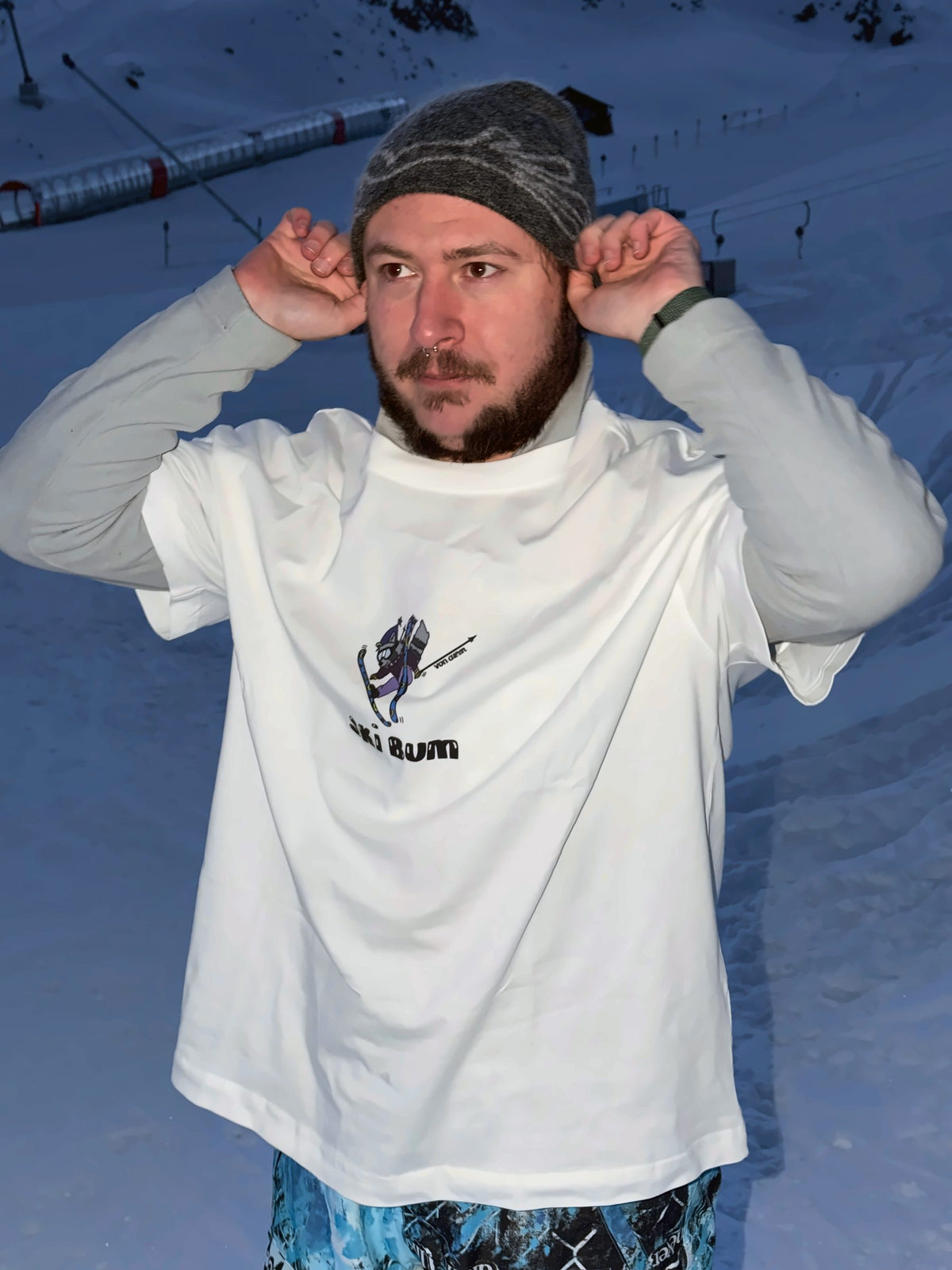 Von Alpen "Ski Bum" tee on the slopes at dusk
